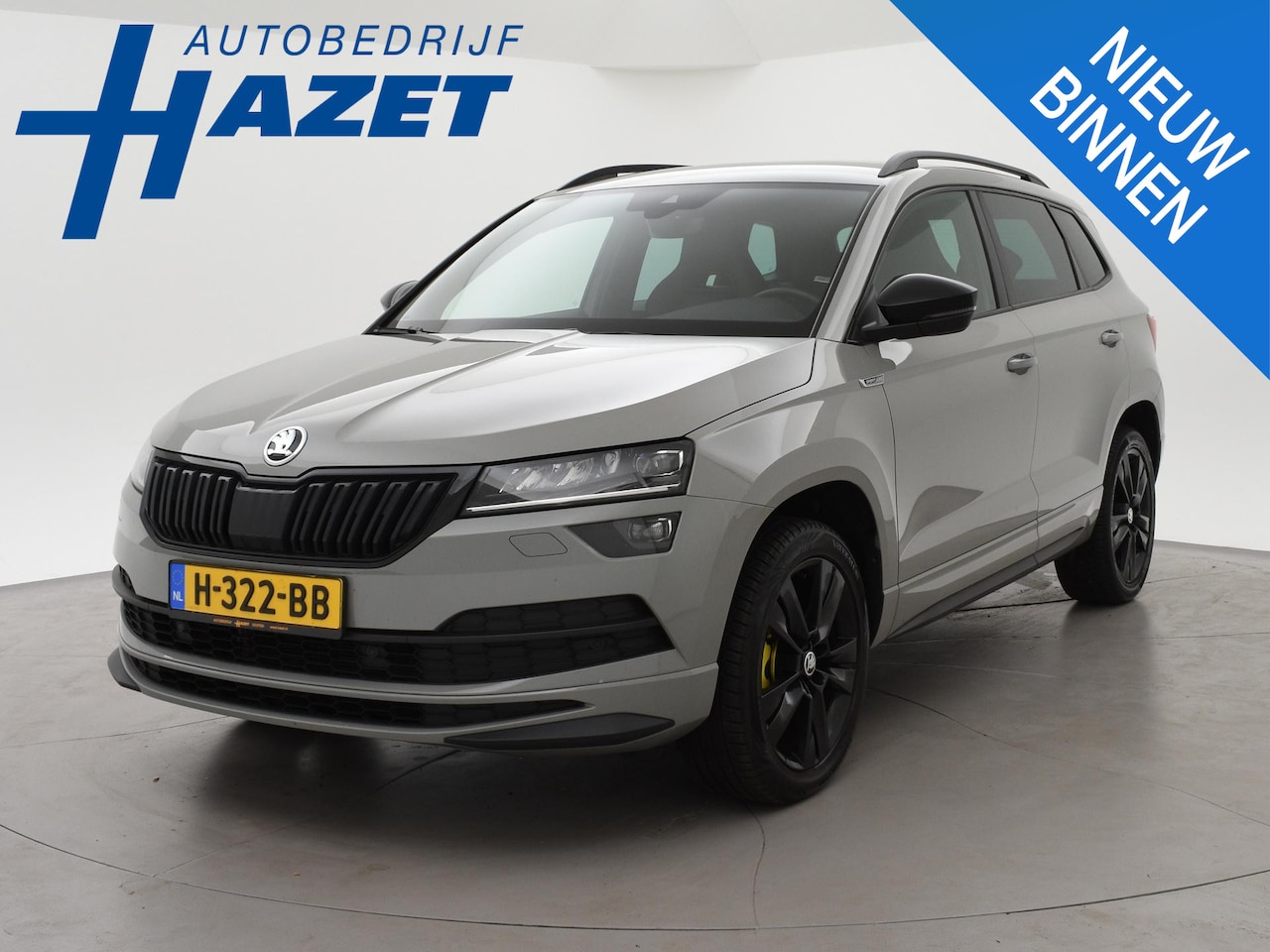 Skoda Karoq - 1.5 TSI ACT SPORTLINE + WEGKL. TREKHAAK | VOL LEDER | ADAPTIVE CRUISE | CANTON | CAMERA - AutoWereld.nl