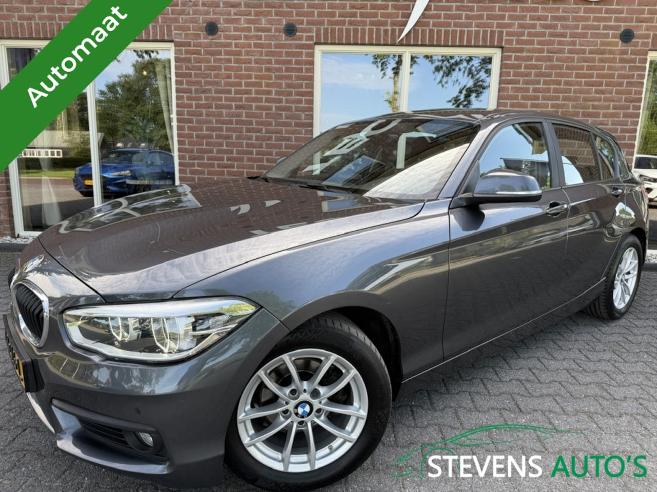 BMW 1-serie - 118i Executive 136 PK AUTOMAAT / SPORTSTOELEN / NAVI / CLIMA / C - AutoWereld.nl