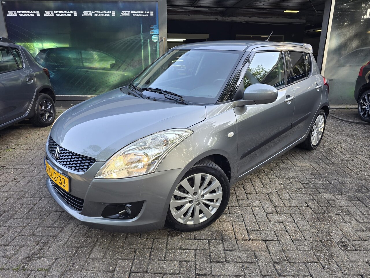 Suzuki Swift - 1.2 Exclusive EASSS| 2E EIGENAAR | 12 MND GARANTIE| NW APK| AIRCO| LMV | - AutoWereld.nl