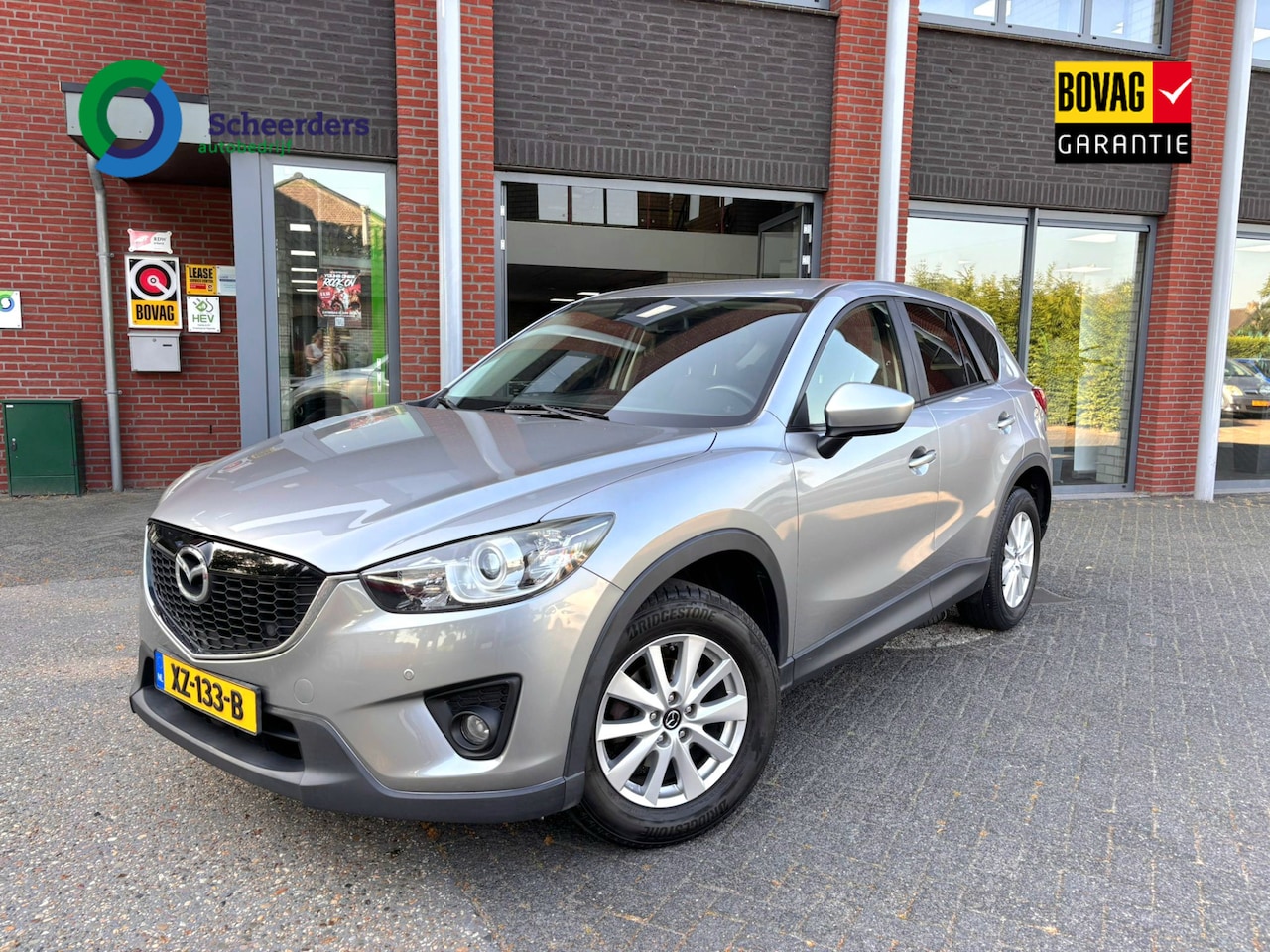 Mazda CX-5 - 2.0 TS 4WD 2.0 TS+ 4WD, trekhaak,Navi,1 jaar garantie - AutoWereld.nl