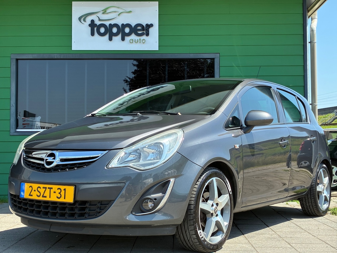 Opel Corsa - 1.2-16V Anniversary Edition | 2e Eigenaar | Navigatie | Airco |Trekaak - AutoWereld.nl