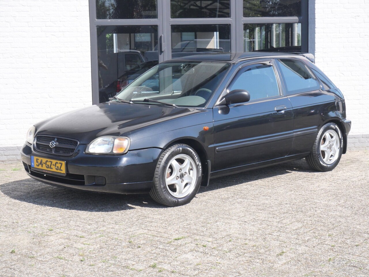 Suzuki Baleno - 1.6 Sport 85000km !!! Airco Stoelverwarming Electr. pakket - AutoWereld.nl