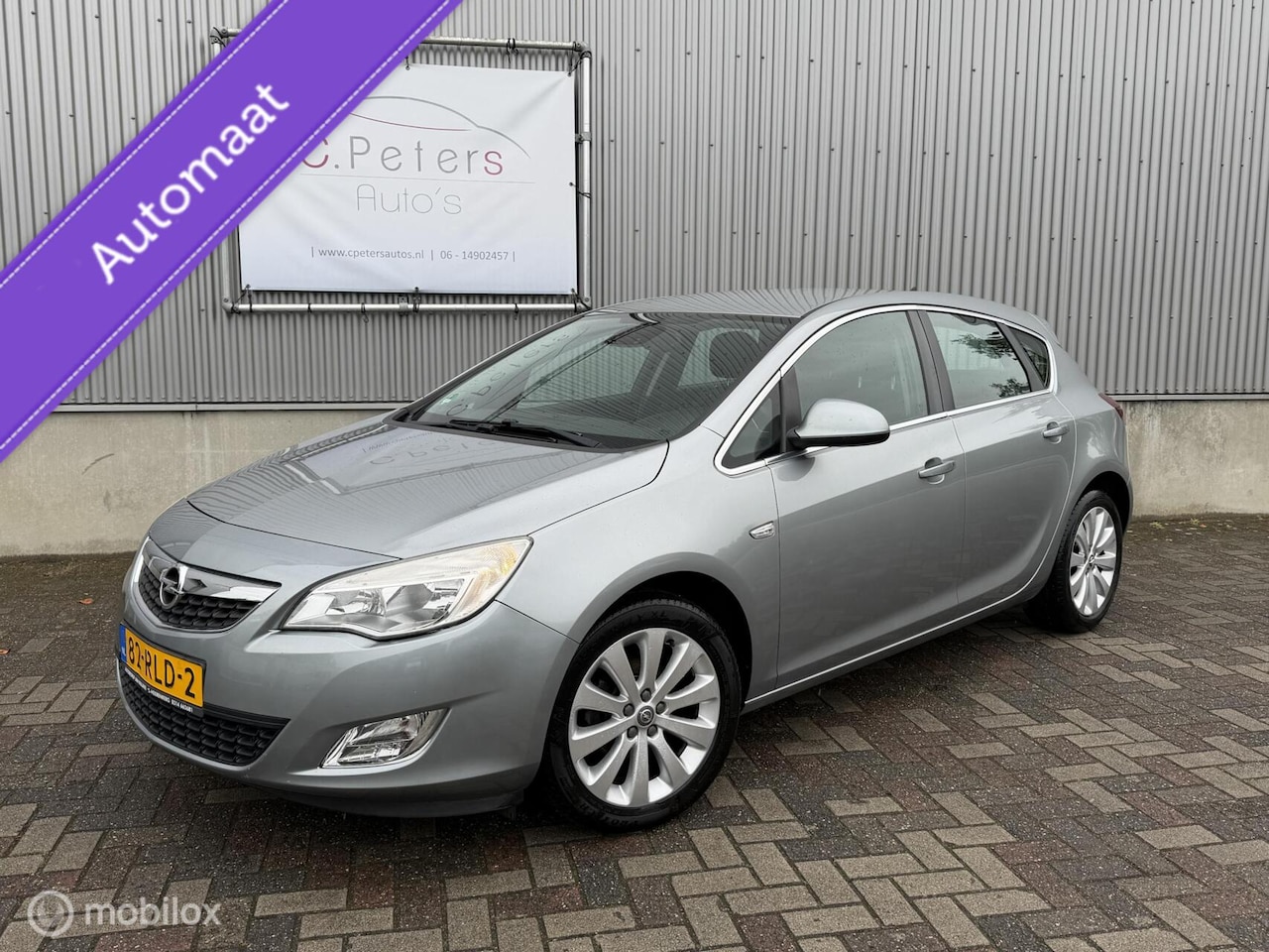 Opel Astra - 1.6 Cosmo 2011 Automaat / Navigatie / Bluetooth / Trekhaak / NAP - AutoWereld.nl