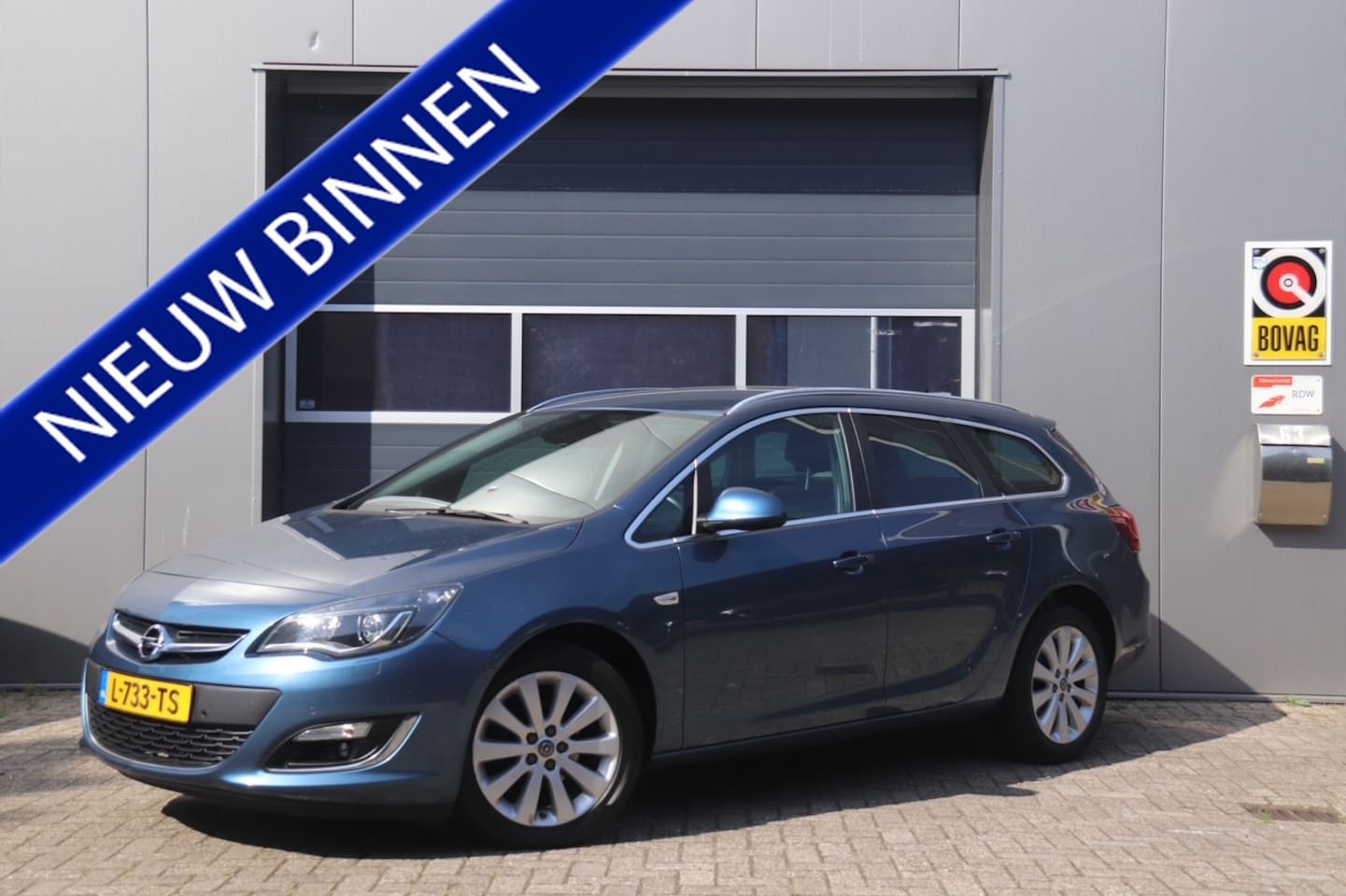 Opel Astra Sports Tourer - 1.4 Turbo Sport 1.4 Turbo Sport +, Stoelverwarming, Trekhaak, Cruise, Navi - AutoWereld.nl