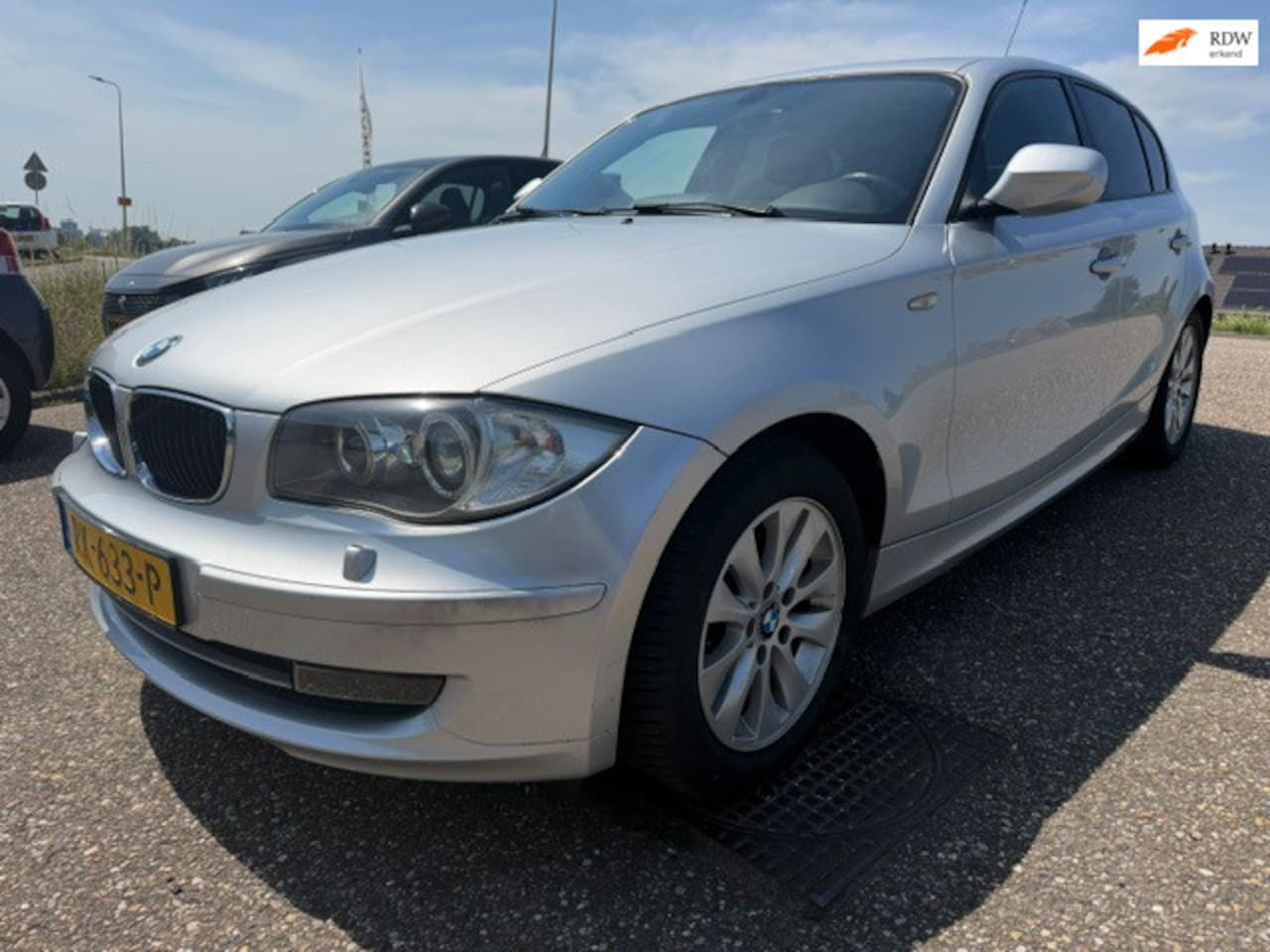 BMW 1-serie - 116i Opendak Airco Stoelverwarming Navigatie PDC - AutoWereld.nl