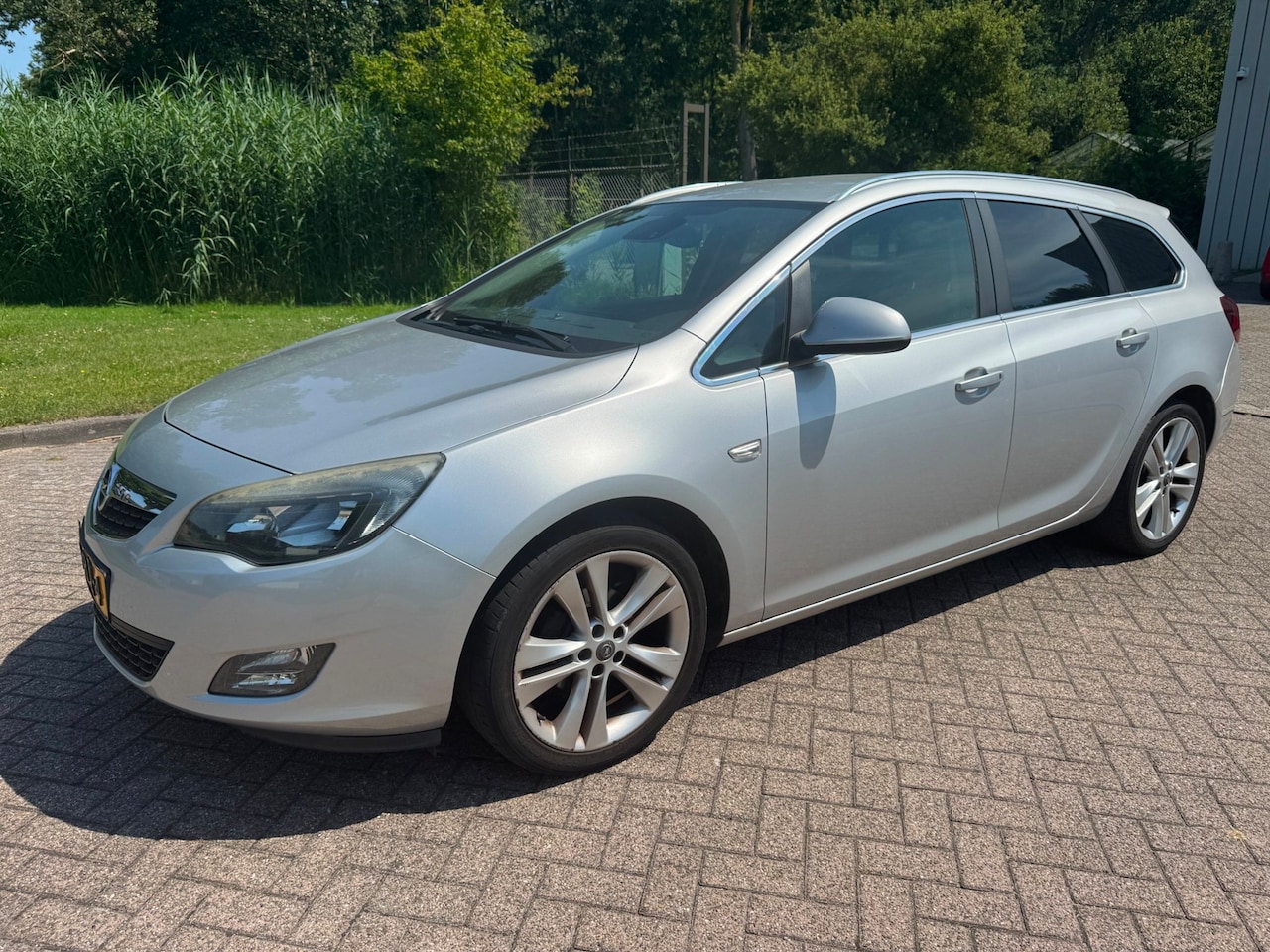 Opel Astra Sports Tourer - 1.4 Turbo Sport/AUT/CLIMA/CRUISE/NAVI/ELEK RAMEN V+A/PARKEERSENSOREN/TREKHAAK - AutoWereld.nl