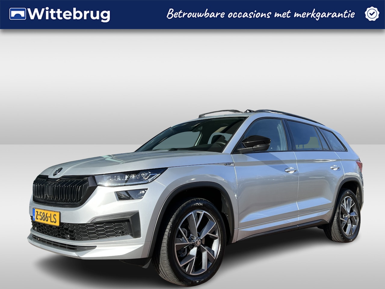 Skoda Kodiaq - 1.5 TSI Sportline Business 7p. / Panoramadak / Zwenkbare trekhaak / Fabrieksgarantie t/m 0 - AutoWereld.nl