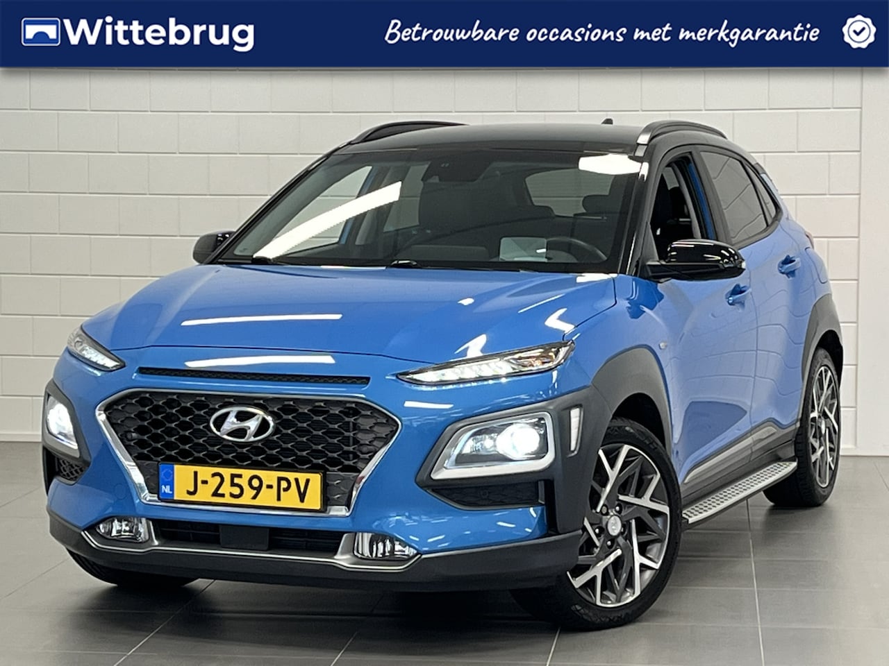 Hyundai Kona - 1.6 GDI HEV Premium LEDER | TWO TONE | 18 INCH VELGEN | ZEER COMPLETE AUTO MET LAGE KM STA - AutoWereld.nl