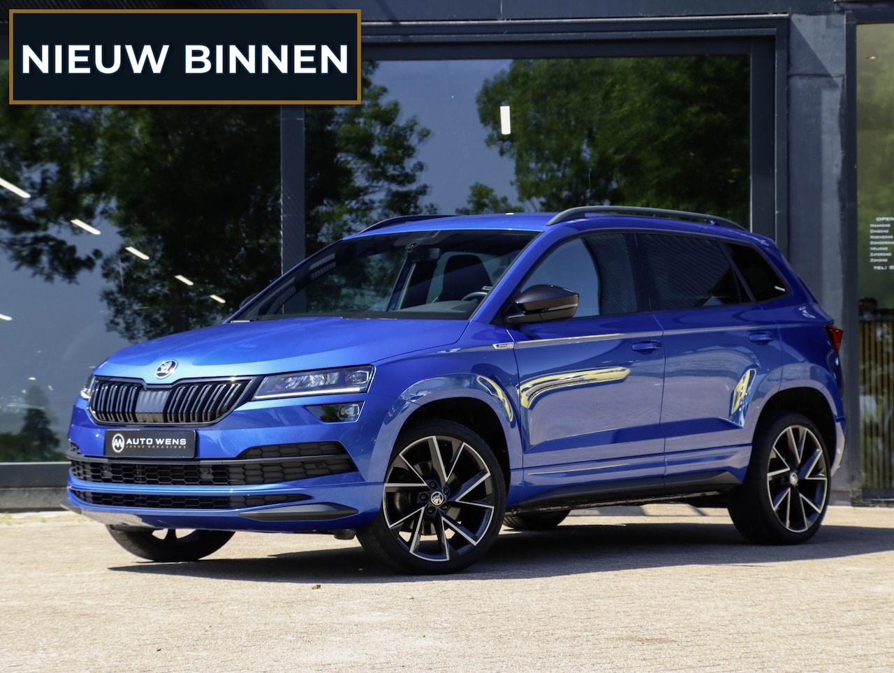 Skoda Karoq - 1.5 TSI ACT Sportline 150PK DSG Camera Navi Stoel/Stuurverw. Race Blue 19 inch - AutoWereld.nl