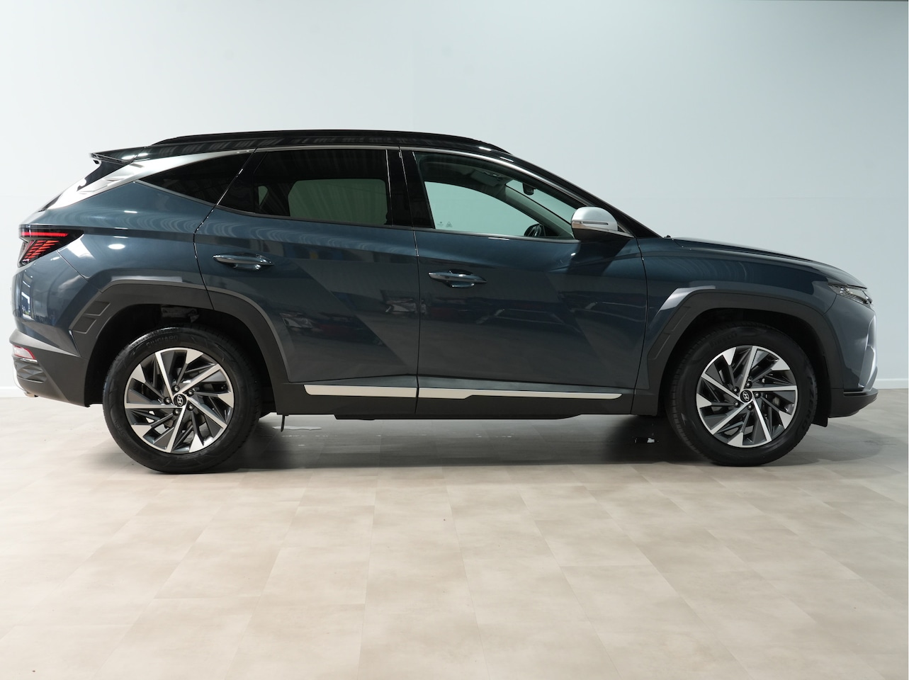 Hyundai Tucson - 1.6 T-GDI HEV Comfort Smart | Trekhaak | Camera | Navigatie | Stoel/Stuurverw. - AutoWereld.nl