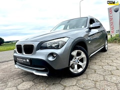BMW X1 - 18i 5DRS NAP IJSKOUDE AIRCO TREKHAAK APK VELGEN FULL OPTION