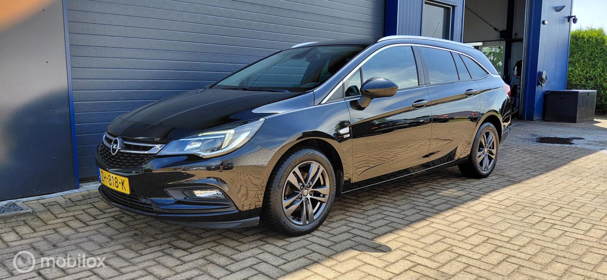 Opel Astra Sports Tourer - 1.4 Turbo 120 Jaar Edition 1.4 Turbo 120 Jaar Edition - AutoWereld.nl