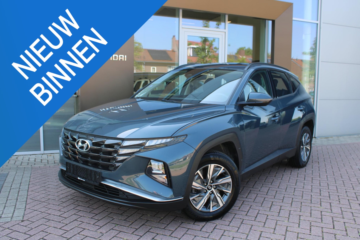 Hyundai Tucson - 1.6 T-GDI HEV 230 Comfort Hybrid Automaat Airco Navi Camera Carplay - AutoWereld.nl