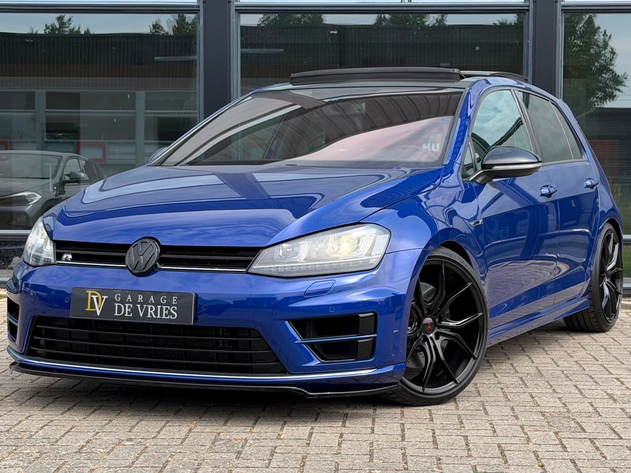 Volkswagen Golf - 2.0 TSI R 4Motion Downpipe Panoramadak Leder Lapiz Blue Metallic - AutoWereld.nl