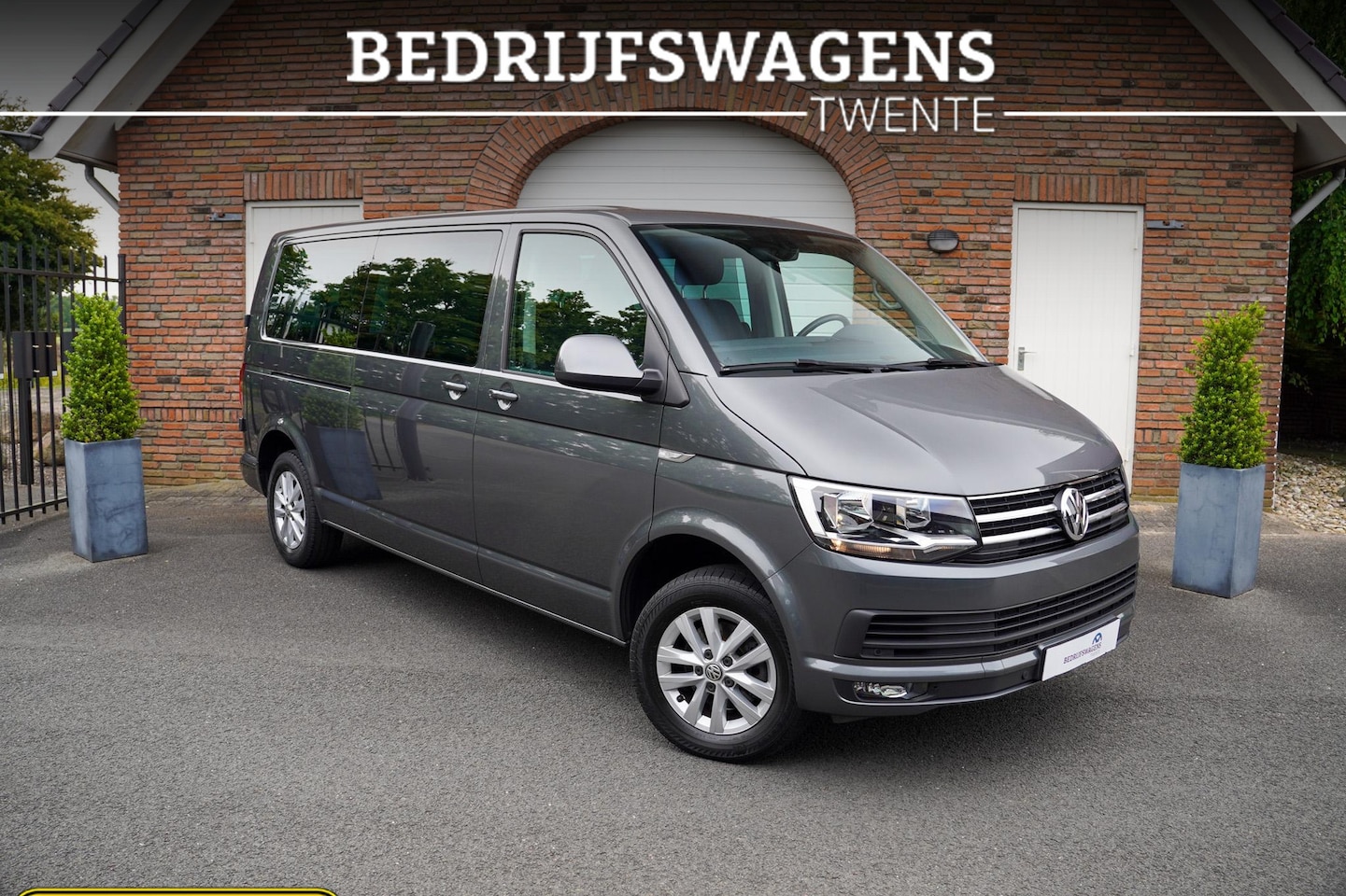 Volkswagen Transporter Caravelle - 2.0 TDI 150PK DSG L2H1 9 Persoons Trekhaak NAVI - AutoWereld.nl