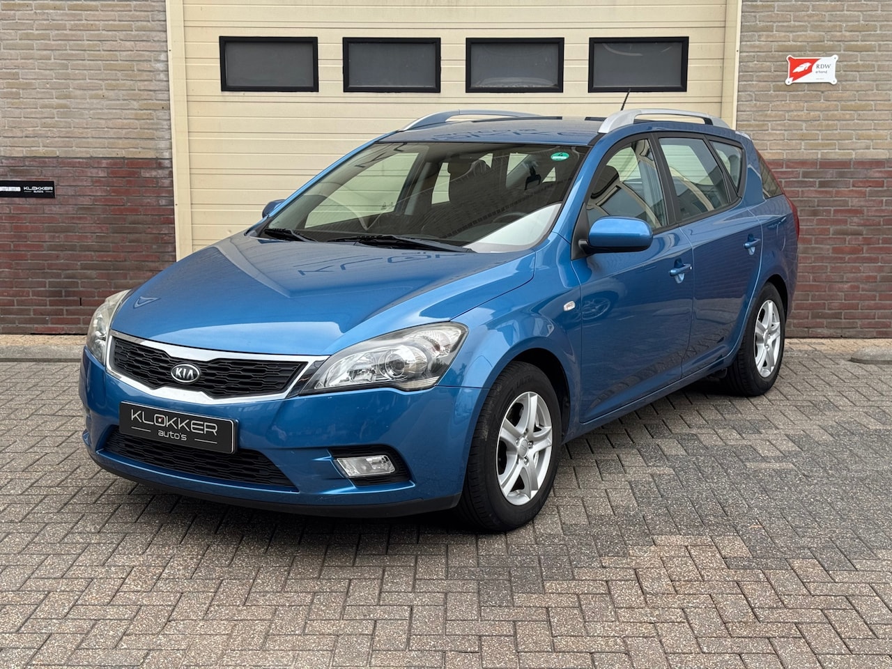 Kia Cee'd Sporty Wagon - 1.4 CVVT X-ecutive Airco|Clima|Cruise|APK 09-2027 - AutoWereld.nl