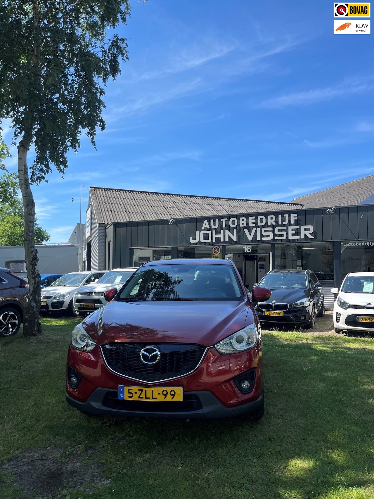 Mazda CX-5 - 2.0 TS+ 2WD * SUV * comfort & elegantie * airco * cruise * stralende metallic rode lak * - AutoWereld.nl
