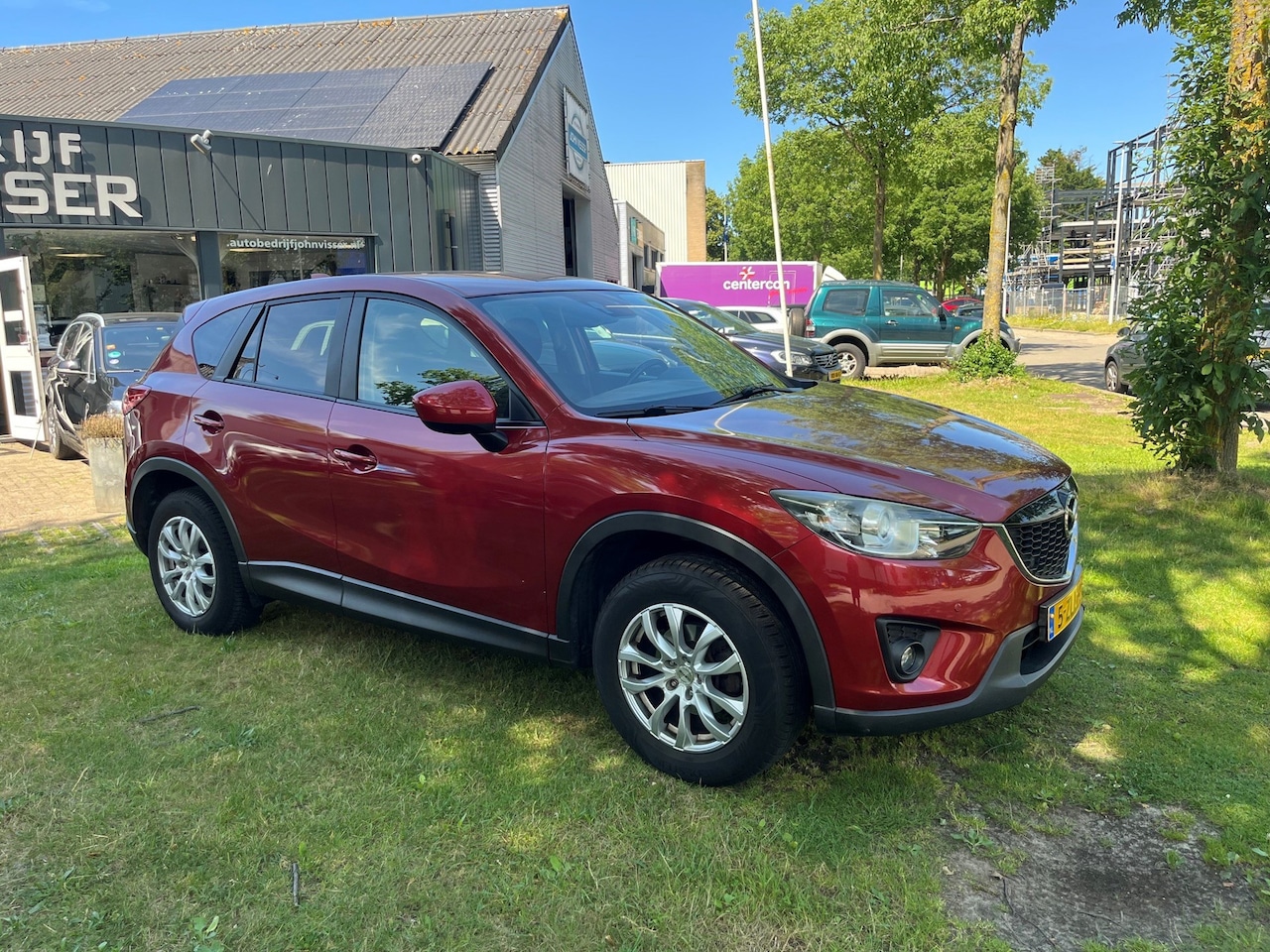 Mazda CX-5 - 2.0 TS+ 2WD * SUV * comfort & elegantie * airco * cruise * stralende metallic rode lak * - AutoWereld.nl