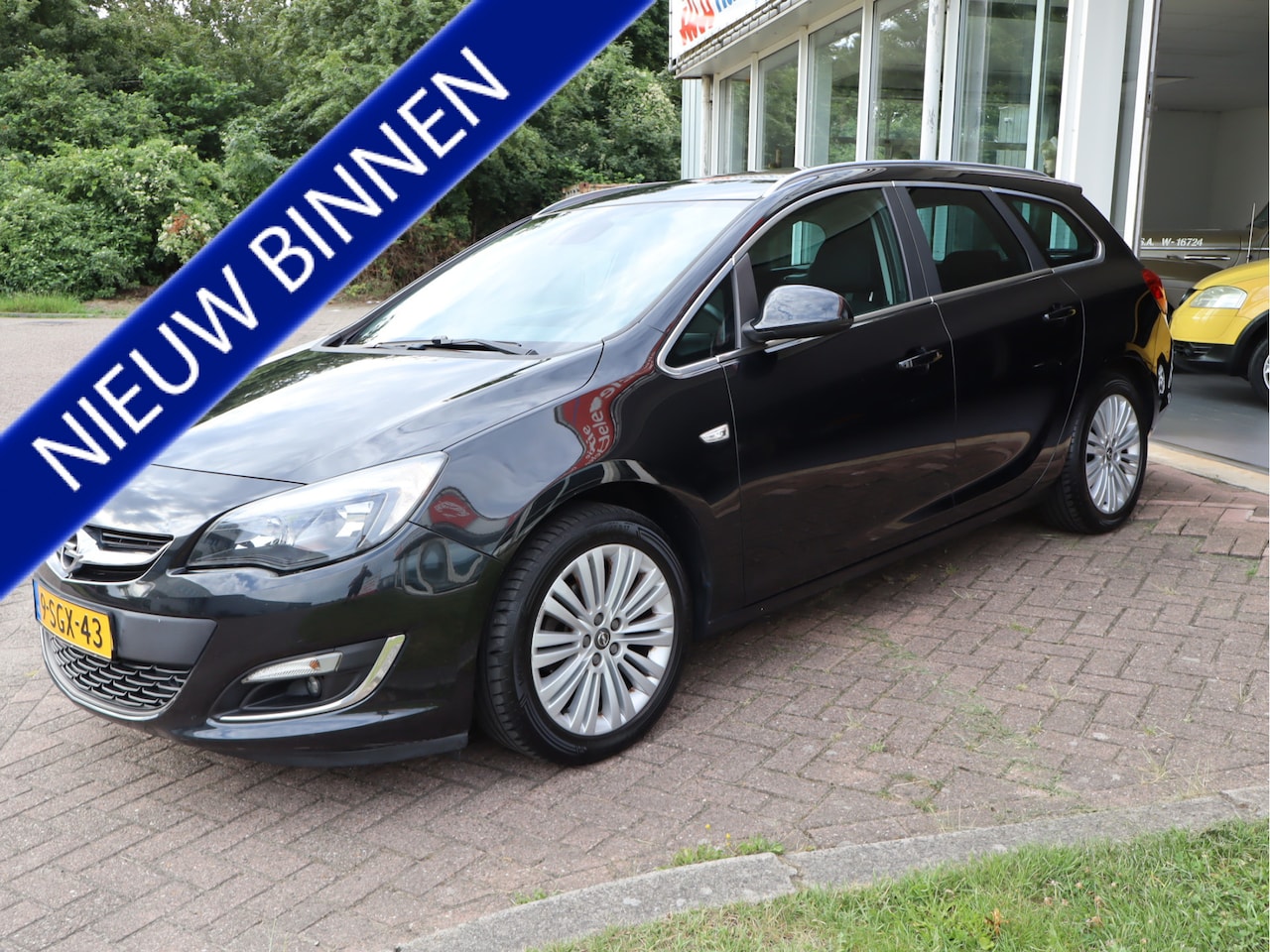 Opel Astra Sports Tourer - 1.4 Turbo Design Edition Keurige Auto! - AutoWereld.nl
