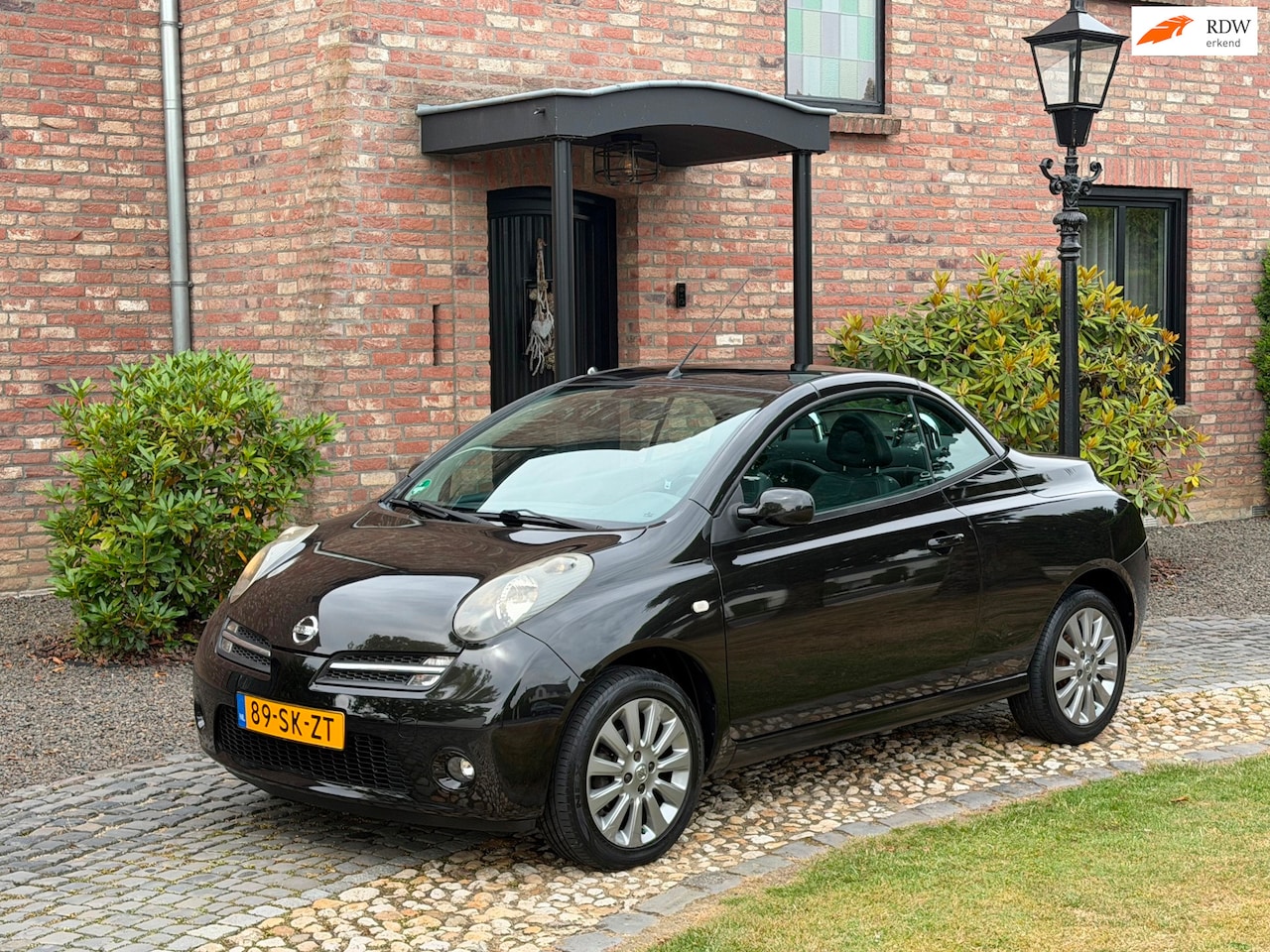 Nissan Micra - 1.6 Tekna Plus Airco ECC Leder Panodak - AutoWereld.nl