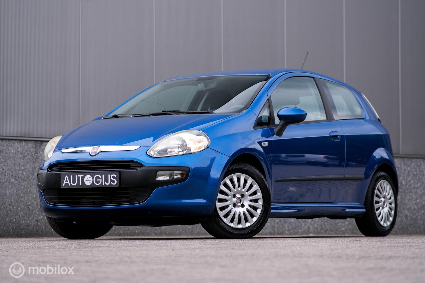 Fiat Punto Evo - 1.3 M-Jet Dynamic | Cruisecontrol | Trekhaak | Airco | lage km stand | All Season banden | - AutoWereld.nl