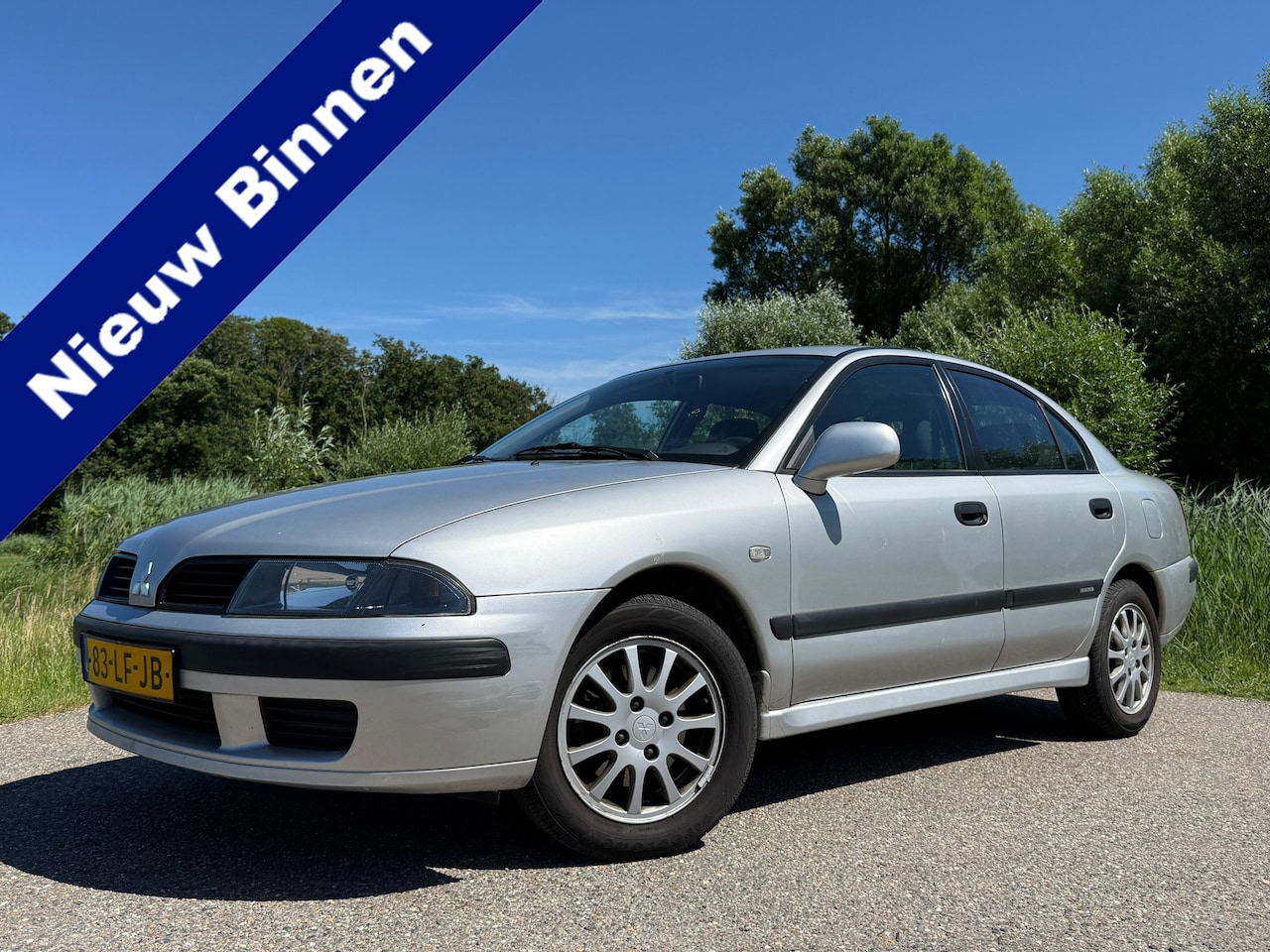 Mitsubishi Carisma - 1.6 Comfort Drive | 1e Eigenaar | slechts 99.576 km | Airco | 15" Velgen | Nieuwe APK | Go - AutoWereld.nl