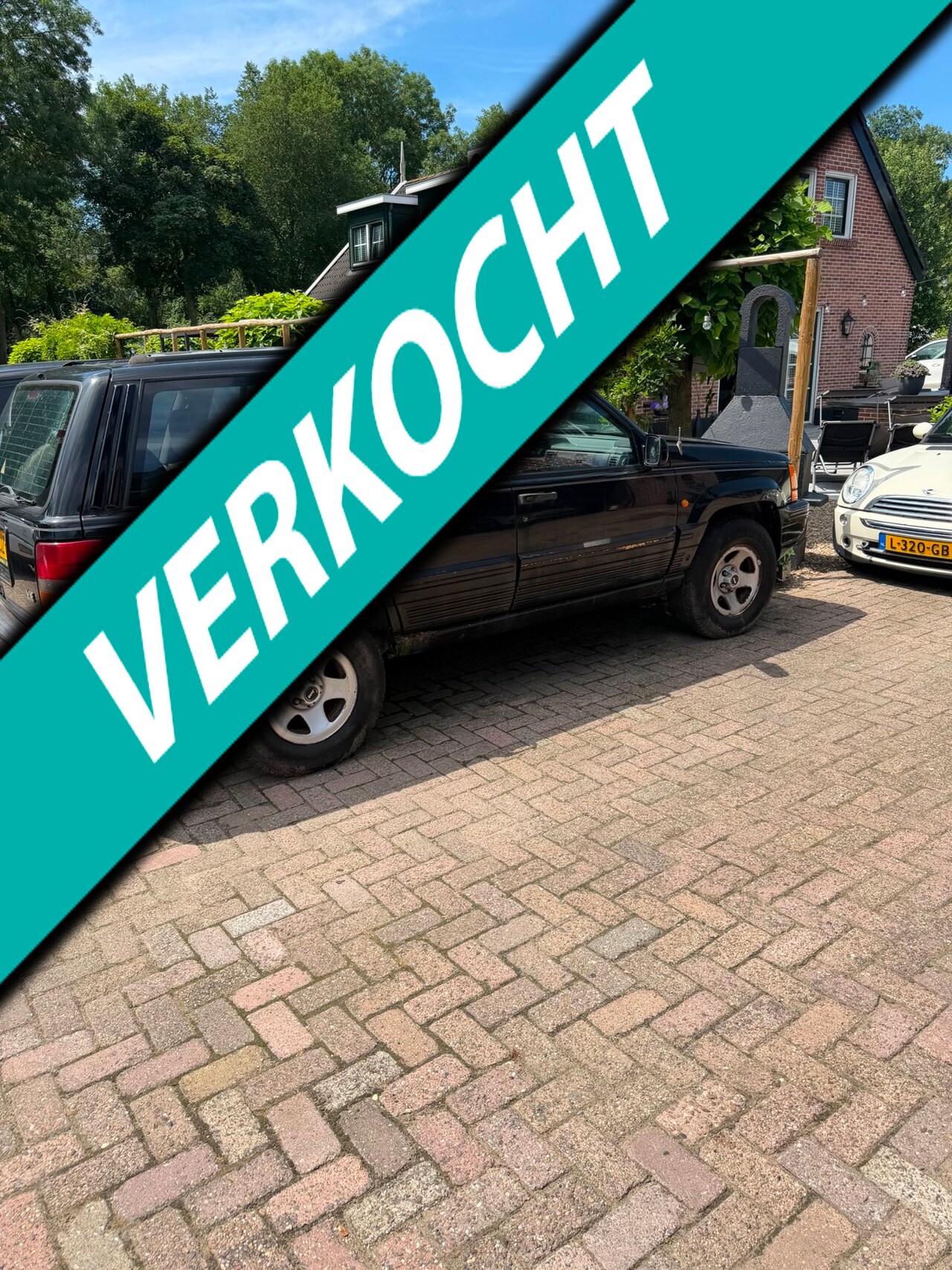 Jeep Grand Cherokee - 5.2i V8 Limited loop of sloop - AutoWereld.nl