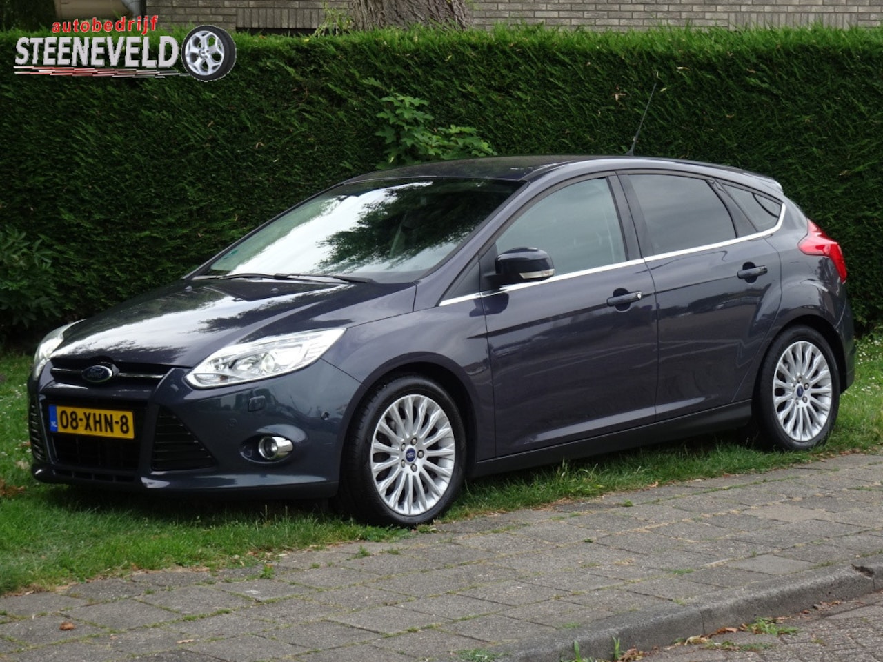 Ford Focus - 1.0 100pk Titanium met Navi, Xenon en Trekhaak - AutoWereld.nl