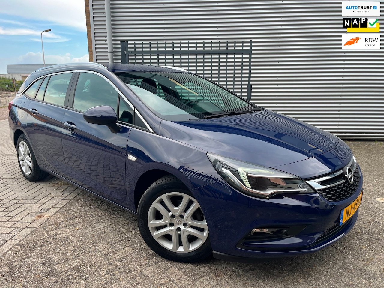 Opel Astra Sports Tourer - 1.4 Online Edition|Carplay|Navi|Airco|Cruise|Trekhaak| - AutoWereld.nl