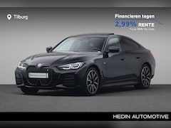 BMW i4 - eDrive40 High Executive 84 kWh | Harman Kardon | Stuurwielrand verwarmd | Glazen schuif-/k