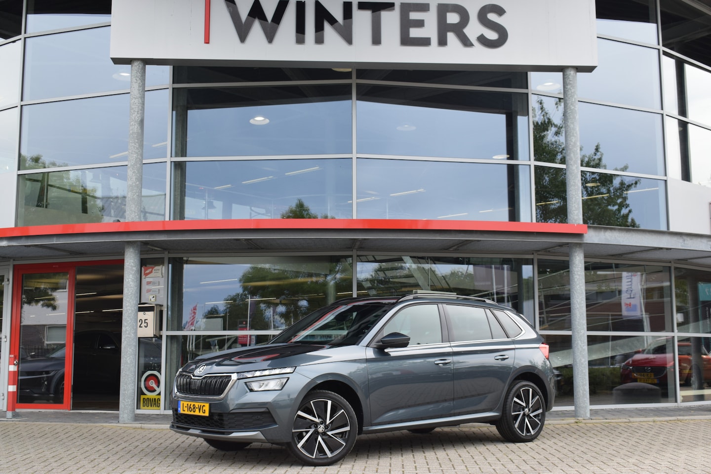 Skoda Kamiq - 1.0 TSI Sport Business Edition | Trekhaak | Panoramadak | Camera | Apple Carplay & Android - AutoWereld.nl