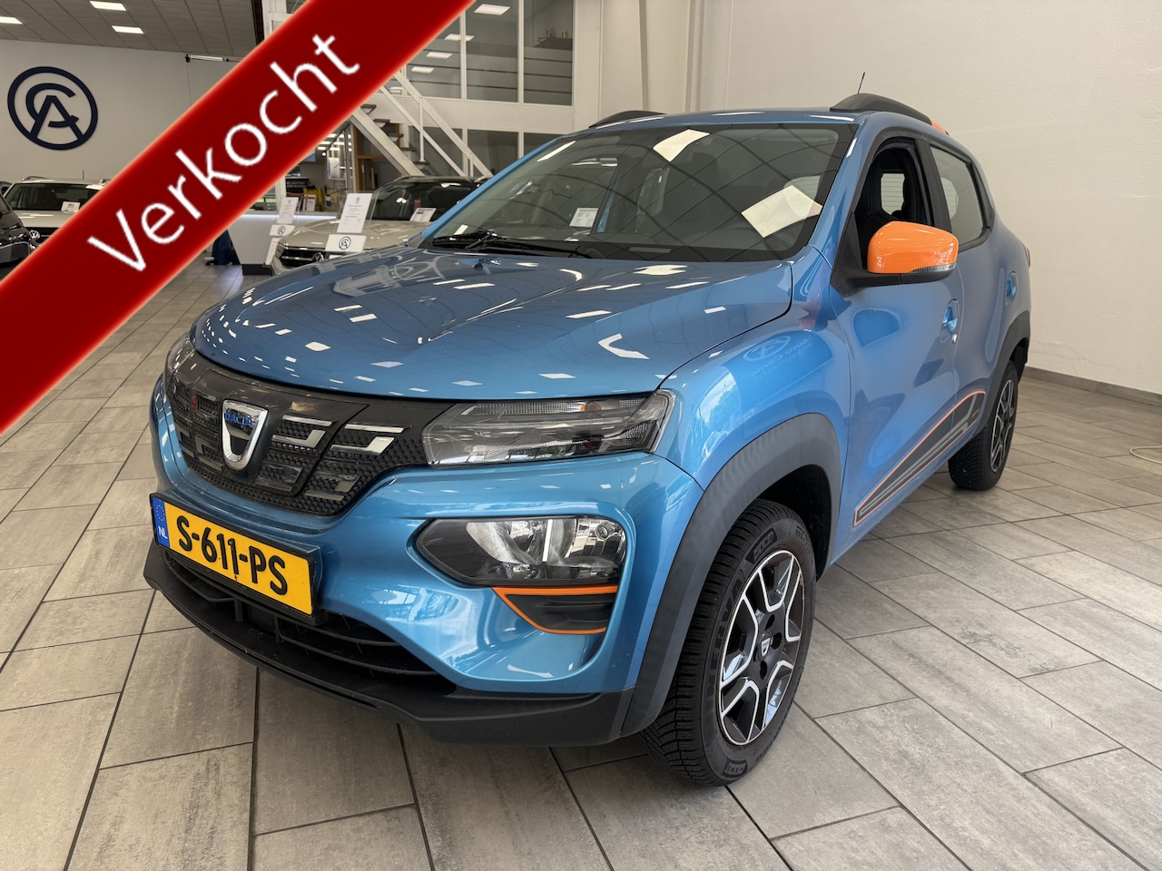Dacia Spring - Comfort Plus (Orange Pack) 27 kWh / LEER / NAVI / CRUISE / - AutoWereld.nl