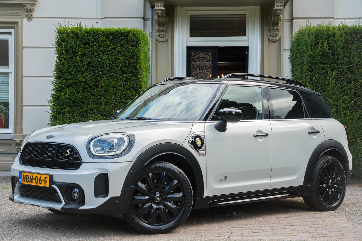 MINI Countryman - 1.5 Cooper S E ALL4 Chili ADAPTIVE | HUD | CAMERA | CARPLAY | HALF LEDER - AutoWereld.nl