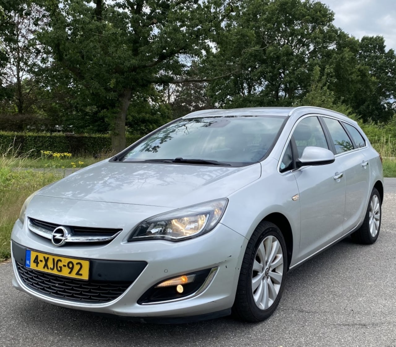 Opel Astra Sports Tourer - 1.4 Turbo LPG Cosmo 1.4 Turbo LPG Cosmo - AutoWereld.nl