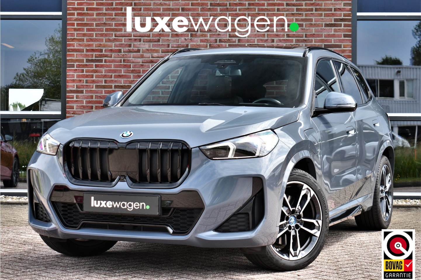 BMW X1 - xDrive30e M-Sport Plus Stormbay Pano ACC HUD 360-cam 19inch - AutoWereld.nl