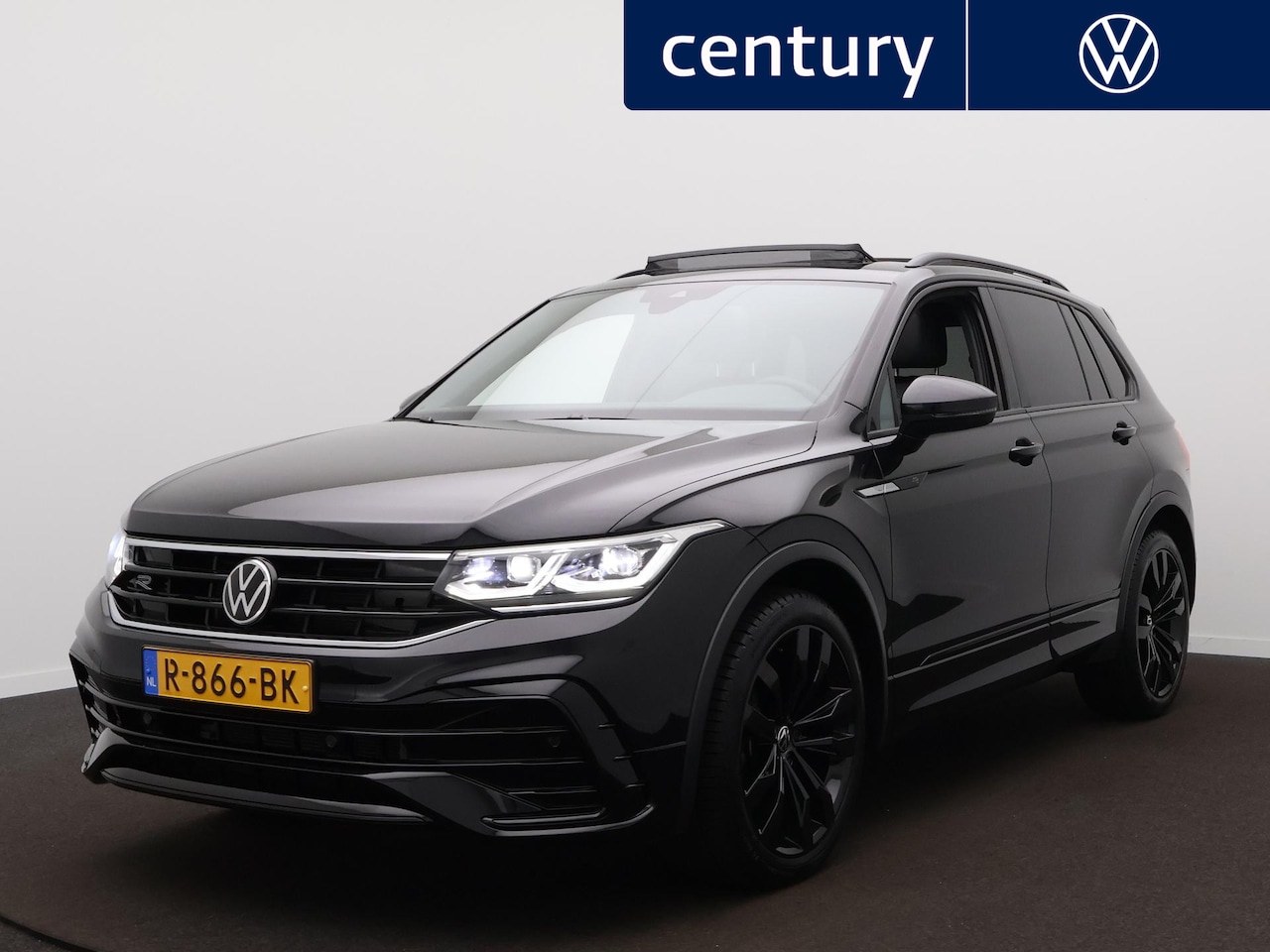 Volkswagen Tiguan - 1.5 TSI R-Line Business+ / Panodak / Camera / Navi / Virtual / Adap. cruise / Elek. Koffer - AutoWereld.nl