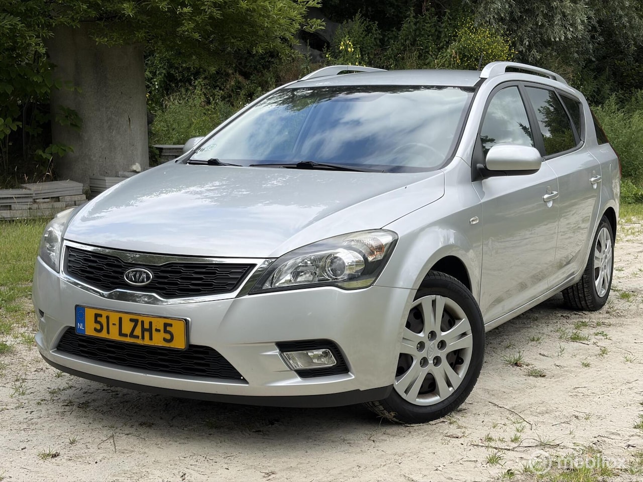 Kia Cee'd Sporty Wagon - Navigatie,Koude airco 1.4 CVVT X-ecutive - AutoWereld.nl