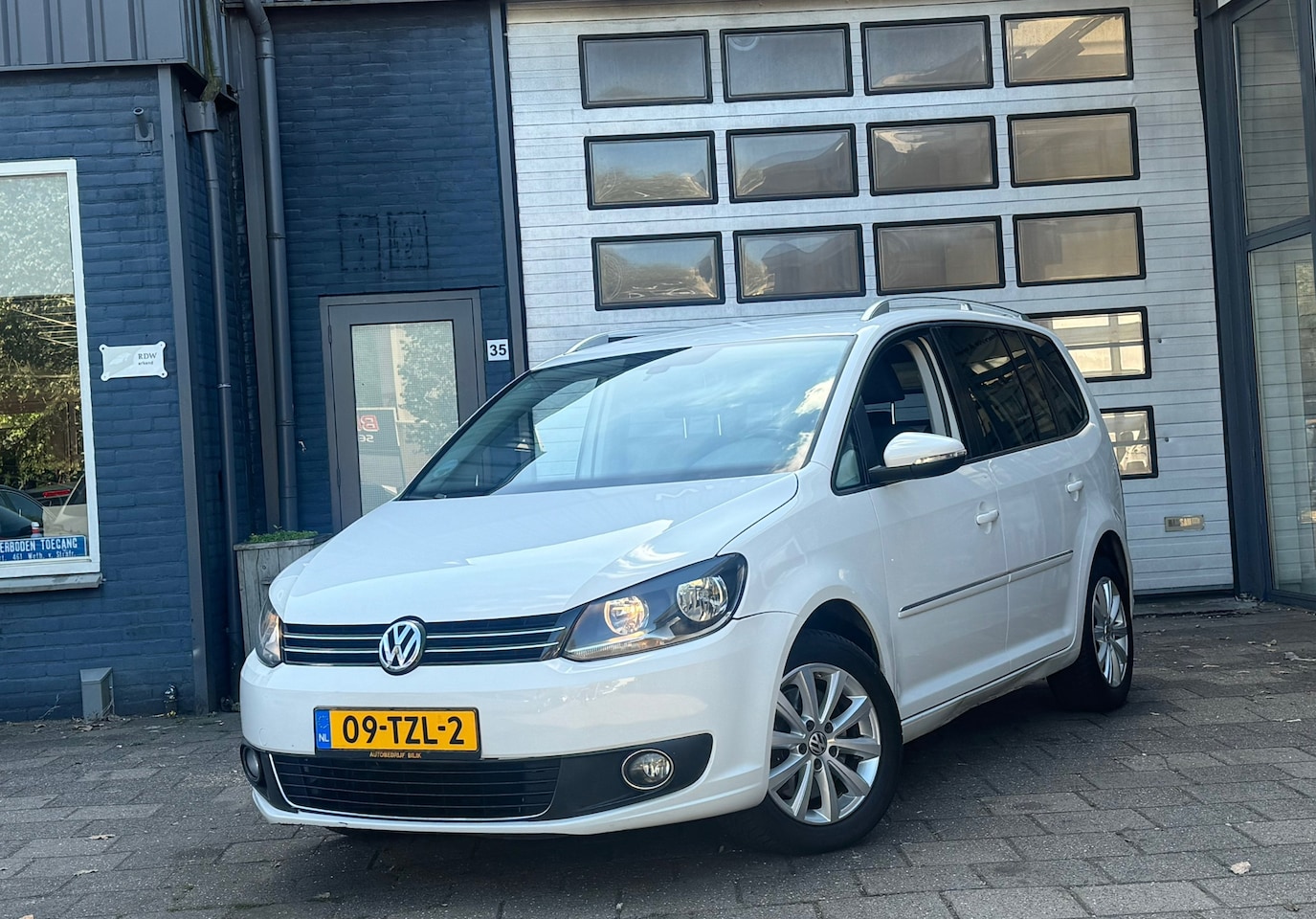 Volkswagen Touran - 2.0 TDI Highline BlueMotion | Clima | Cruise | Navi | DSG - AutoWereld.nl