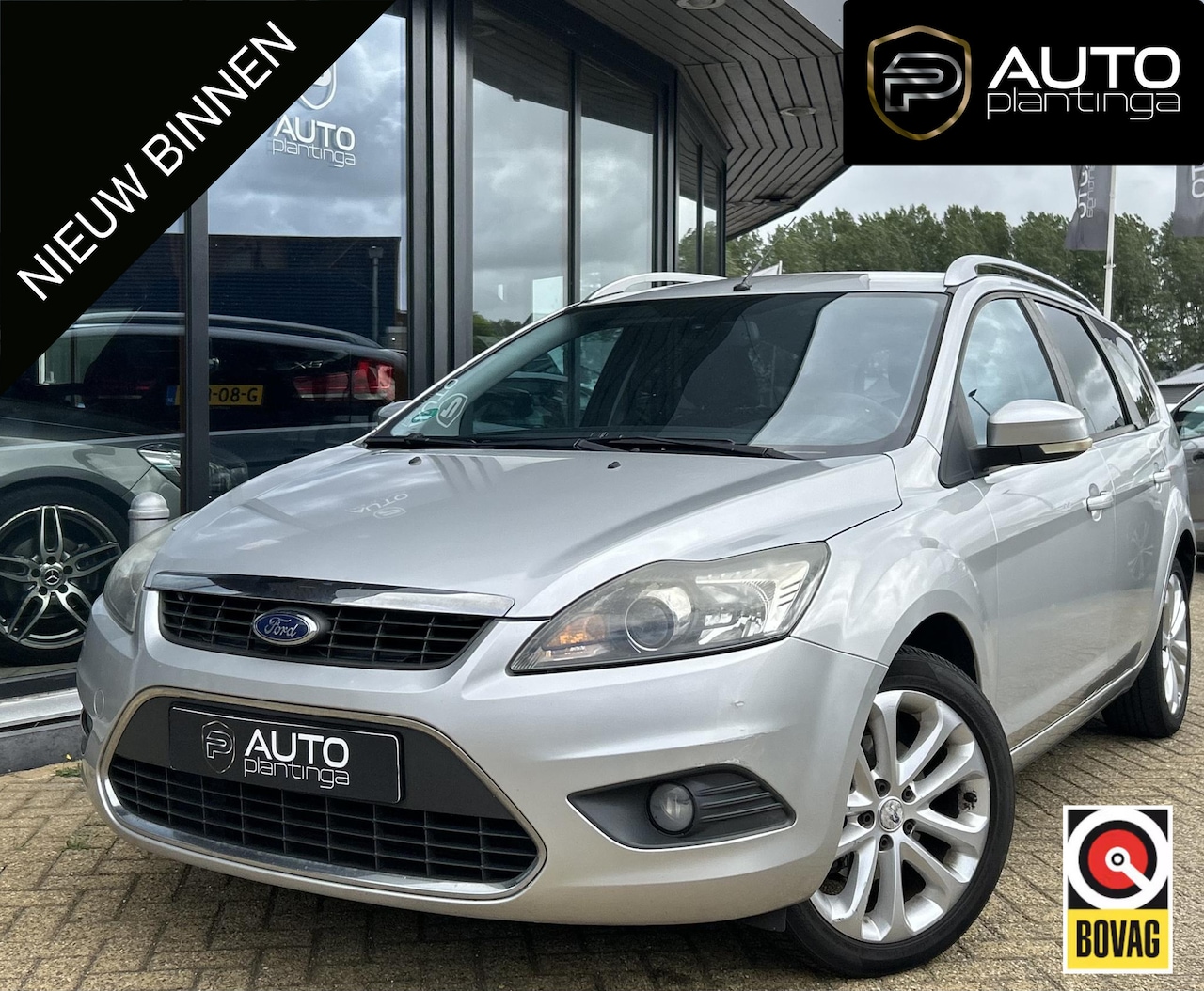 Ford Focus Wagon - 1.6 Titanium 101PK | NL AUTO | Trekhaak | Parkeersensoren | Spoiler | Lichtmetalen Velgen - AutoWereld.nl