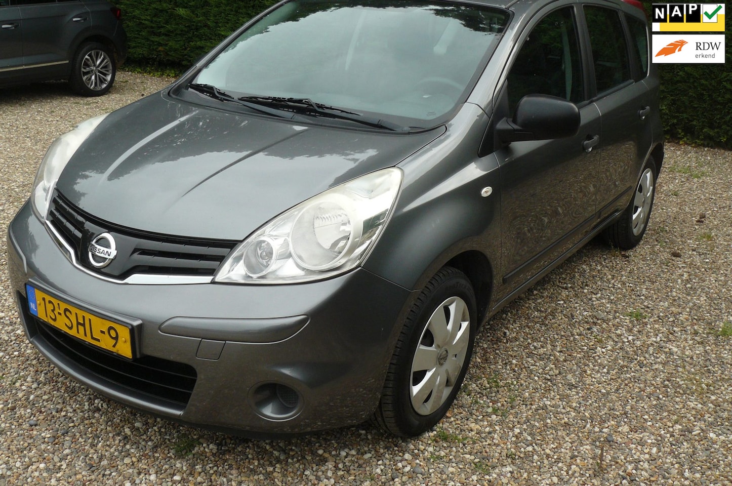 Nissan Note - 1.4 Visia apk 26-2-2027 lichte hagelschade hier en daar - AutoWereld.nl