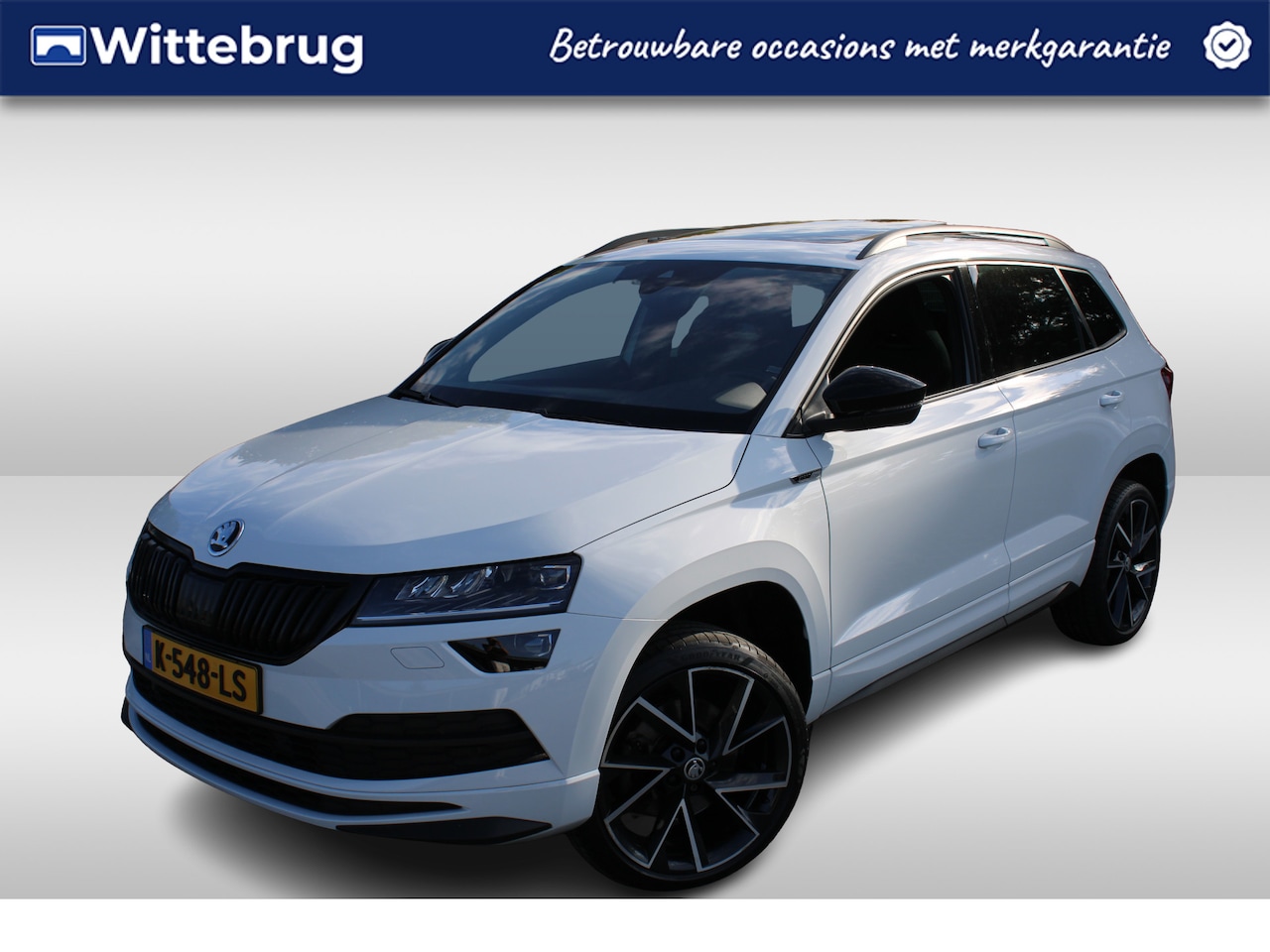 Skoda Karoq - 1.5 TSI 150pk ACT Sportline Business DSG Automaat / Panorama schuifdak / Camera /  LED / v - AutoWereld.nl