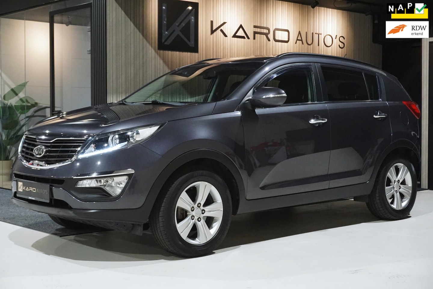 Kia Sportage - 1.6 GDI X-ecutive Plus Pack Clima Cruise Trekhk - AutoWereld.nl