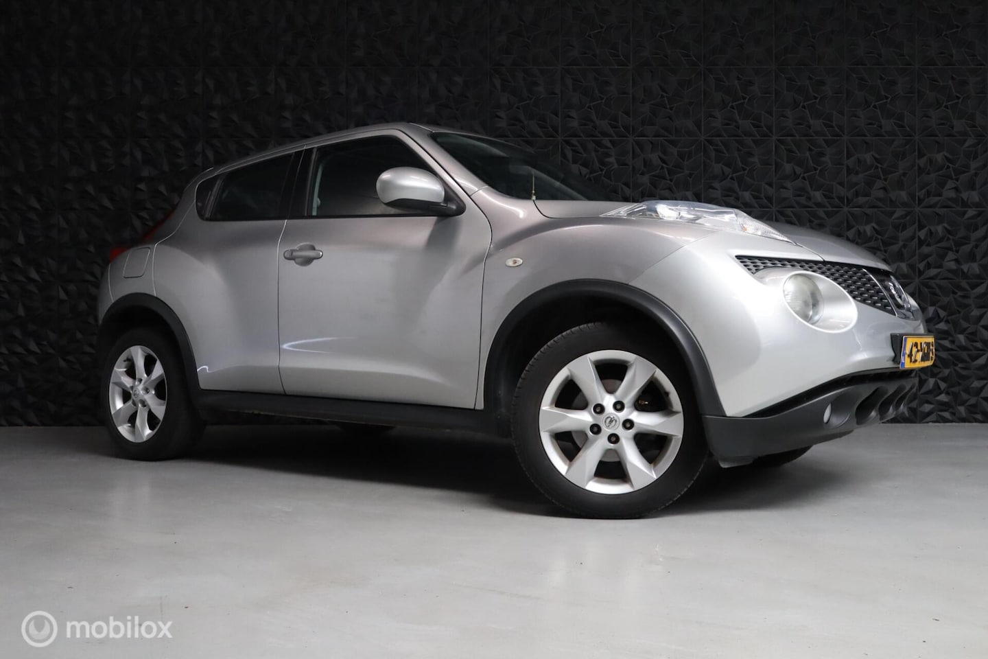 Nissan Juke - 1.6 Acenta Eco | Camera | Cruise | NAV | AC | BT - AutoWereld.nl