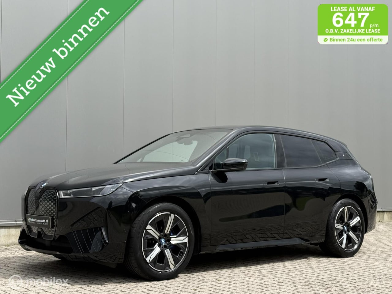 BMW iX - xDrive40 77 kWh Pano dak | Trekhaak | Laser |SOH 98% - AutoWereld.nl