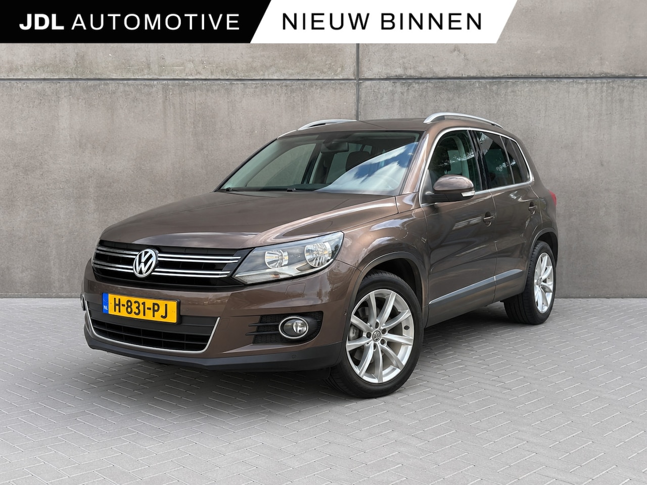 Volkswagen Tiguan - 1.4 TSI Sport&Style | Trekhaak | Panoramadak | Cruise control | Volledige historie | - AutoWereld.nl