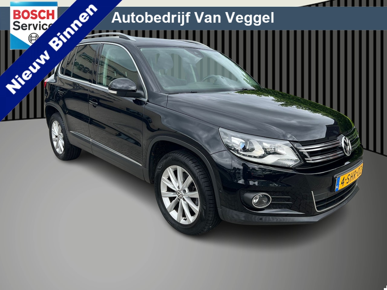 Volkswagen Tiguan - 1.4 TSI Sport&Style pano, xenon, cruise, navi, trekhaak - AutoWereld.nl