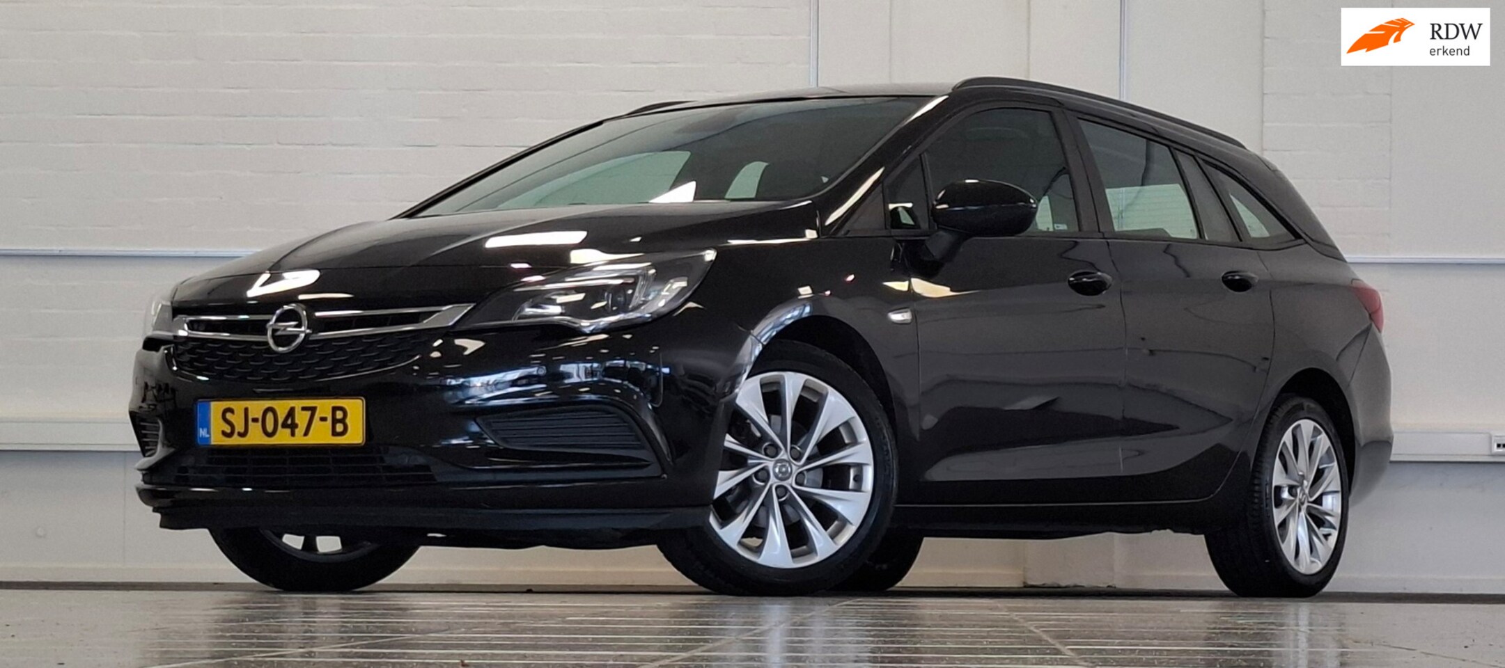 Opel Astra Sports Tourer - 1.0T Innovation Navigatie Garantie Mooi! - AutoWereld.nl