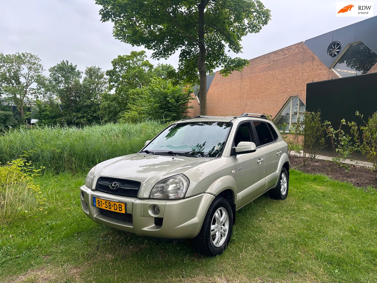 Hyundai Tucson - 2.0i 4WD Style Airco Cruise PDC Trekhaak - AutoWereld.nl