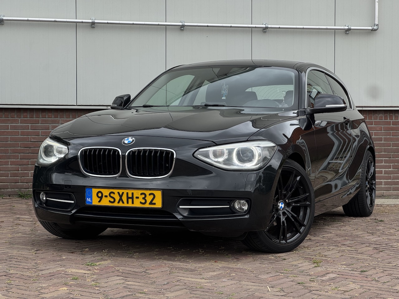 BMW 1-serie - 114i EDE Upgrade Edition SPORT | LEDER | AIRCO | CRUISE - AutoWereld.nl