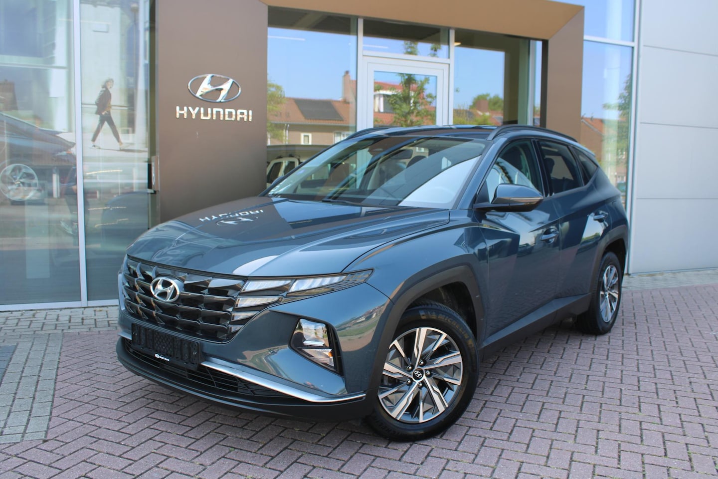 Hyundai Tucson - 1.6 T-GDI HEV 230 Comfort Hybrid Automaat Airco Navi Camera Carplay - AutoWereld.nl